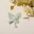 Green tulle butterfly patch detail, beaded tassel accessory for DIY crafts and decor. - Green