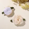 Close-up detail shot of mesh fabric rose hair clips with green ribbon leaves, showing front and back. - 1 Piece / Apricot