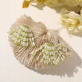 Detailed shot of fresh green beaded flower earrings or hair accessories with a natural style. - Style 42 / 1 Piece