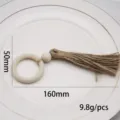 Rond de serviette en corde de jute tressée main avec perles en bois et pompon style champêtre. - Style 1