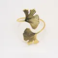 Elegant gold metal ginkgo leaf napkin ring for wedding table decor and hotel dining setup. - Gold
