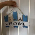 Coastal wooden welcome sign with starfish and shell details, perfect for summer home wall decor. - Standard Type