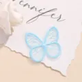 Detail view of light blue organza butterfly embroidery patch for hair accessories and clothing. - Butterfly / Sky Blue