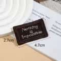 Dark brown embroidered woven fabric patch label with motivational text for diy clothing items. - Nothing / Coffee