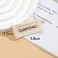 Beige woven fabric clothing label patch, embroidered DIY accessory, 3.8x1.9cm size detail shot. - GUANCHAO / Light Coffee