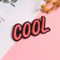 Close up detail view of the creative embroidered cool letter patch, ideal for DIY clothing decoration. - Style 12 (cool)