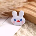 Detailed close-up view of cute cartoon animal embroidery patch, fine stitching, perfect DIY decor. - Cartoon Animal