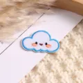 Cute embroidered cloud patch with smiling face, blue border, perfect for DIY clothing decor. - Cloud
