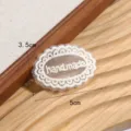 Handmade lace applique patch, oval floral embroidery design for clothing DIY decor. - Oval Handmade Lace Patch