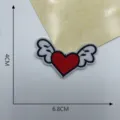 Heart wing embroidered patch DIY clothing accessory measuring 6.8x4cm for apparel decoration. - Style 12