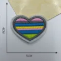 Close-up detail of a colorful heart-shaped embroidered patch, 4x5cm DIY clothing accessory. - Style 13