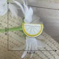 Close-up of cute lemon slice embroidered patch, exquisite stitching and bright yellow details. - Style 15