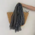 Detailed view of lightweight breathable striped scarf, vintage literary style accessory. - Black and Gray