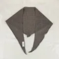 Detail shot of the brown plaid rhombus scarf, showing fine texture and unique cut. - Khaki