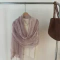 Detailed view of the elegant gold-thread crinkled solid color scarf shawl, chic texture. - Pink
