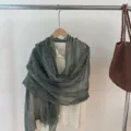 Elegant solid color tassel scarf shawl detail view, soft draped fabric texture for women fashion style. - Green