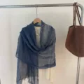 Dark blue tassel scarf shawl, elegant Korean style lightweight accessory draped on hanger. - Blue