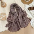 Detailed close-up view of vintage crinkled striped scarf, showing unique fabric texture and fringe. - Dusty Pink