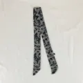 Detailed view of black and white paisley print skinny silk scarf for elegant women neckwear. - PDXJ-Paisley Black / 100*5cm
