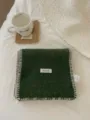 Detailed close-up view of dark green knitted winter scarf with thick contrast stitch. - Dark Green