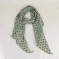 Detailed view of sage green and brown polka dot silk scarf for summer neckwear decoration. - Wave Dot / Green