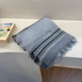 Detailed shot of retro striped cotton linen scarf with frayed fringe edges, textured accessory. - Sky Blue