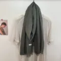 Detail view of solid color dark grey cotton scarf with fringe, soft and versatile for daily wear. - 180x60cm / Army Green