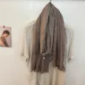 Detailed view of the brown solid color soft cotton scarf with fringe, minimalist unisex style. - 180x60cm / Coffee