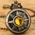 Vintage bronze quartz pocket watch with hollow floral carved case and central yellow crystal. - Waist Chain / Yellow Stone - Waist Chain