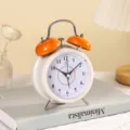 4-inch metal twin bell alarm clock, white dial bedside silent clock for bedroom home. - 12x8x6.5cm / Orange