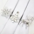 Silver Christmas napkin rings set featuring snowflake, tree and reindeer designs for table decor. - Silver Set 3
