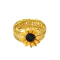Gold metal curtain tieback detail featuring an attractive yellow sunflower design for home decor. - Yellow