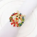 Christmas reindeer napkin ring detail with colorful rhinestones and bow for holiday table decor. - 5