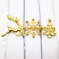 Gold Christmas napkin rings set featuring reindeer snowflake and tree designs for holiday table. - Gold Set Four
