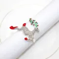 Rhinestone reindeer napkin ring detail, silver metal holiday table decor closeup view. - Reindeer