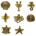 8pz Anelli per Tovaglioli in Metallo Dorato Tema Marino Conchiglia Stella - Oro antico