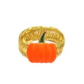 Detailed view of gold metal spring curtain tieback with vibrant orange enamel pumpkin decor. - Orange