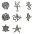 Set 8 portatovaglioli in metallo tema oceano aragosta stella marina decorazione tavola. - Argento Antico