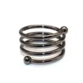 Close-up detail of the gunblack metal spiral napkin ring featuring dual bead ends. - Gun Black