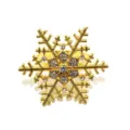 Gold snowflake napkin ring with sparkling rhinestones for hotel dining table and holiday decor. - 44