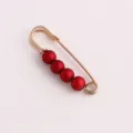 Gold safety pin brooch with four red matte beads for clothing anti-glare detail view - Gold Pin Red Pearl / 3.8CM