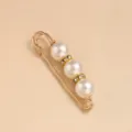 Detailed close-up of the elegant gold tone pearl brooch pin, showcasing fine craftsmanship. - Three Pearls 12MM Two Rhinestone Rings / 5.8cm