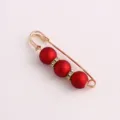 Gold-tone safety pin brooch featuring matte red beads and rhinestones for dress waist adjustment. - Eraser / 5.8cm / Red