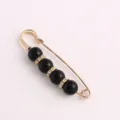Gold tone safety pin brooch with black beads and crystal spacers for waist tightening clothing. - 7.5cm / Black