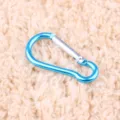 Detailed view of a bright blue aluminum alloy gourd carabiner, showing smooth metallic finish. - Light Blue