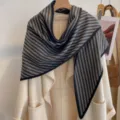 Detailed view of the grey and black striped triangle scarf, warm thickened knit design. - HSJ-3-Black Gray