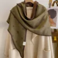 Close-up view of the cozy thickened star jacquard triangular scarf showing fine bound edges. - HSJ-6-Green