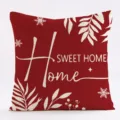 Red Christmas cushion cover with white botanical and letter prints, perfect for holiday home decor. - SQL-004