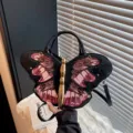 Unique butterfly shape handbag stylish black shoulder crossbody bag metallic gold variant - Pink
