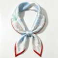 Women's 100% silk small square scarf featuring elegant blue botanical print and chic red border. - Light Blue Botanical Floral